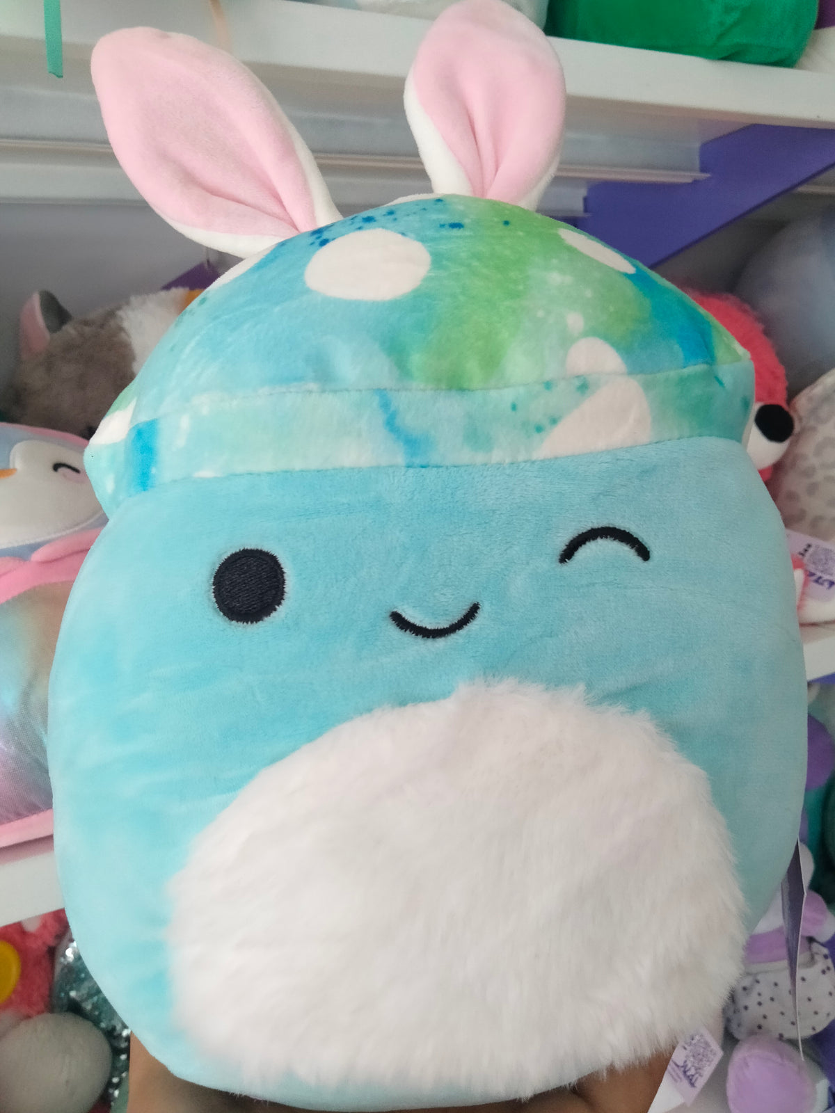 Mully the Teal Mushroom character wearing bunny ears.