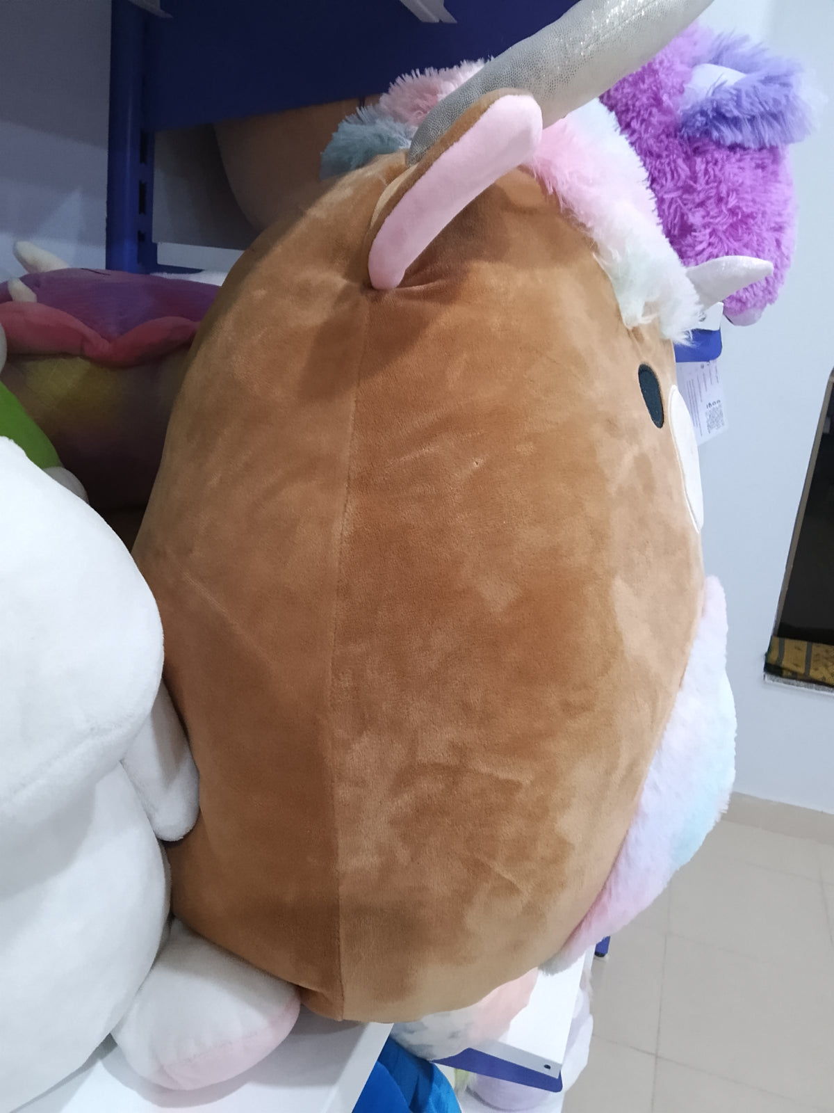 Squishmallows Candela the Highland Cow plush toy.