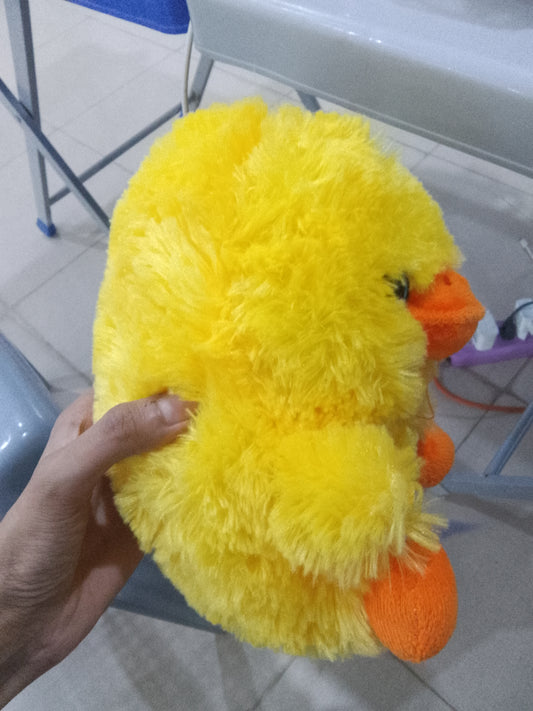 Nanco Belly Buddy yellow plush duck stuffed animal fluffy texture and orange beak and feet.