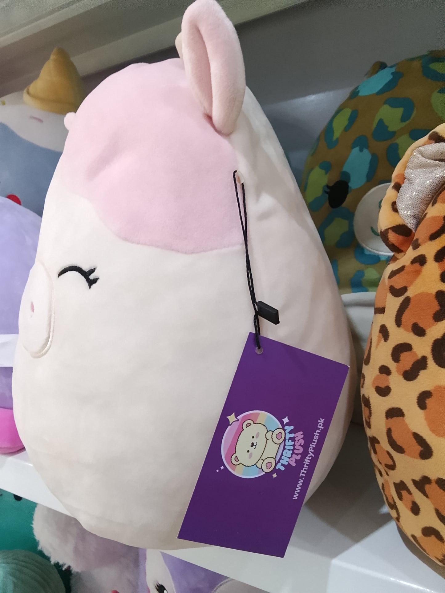 Squishmallows Caedyn the Cow plush toy.