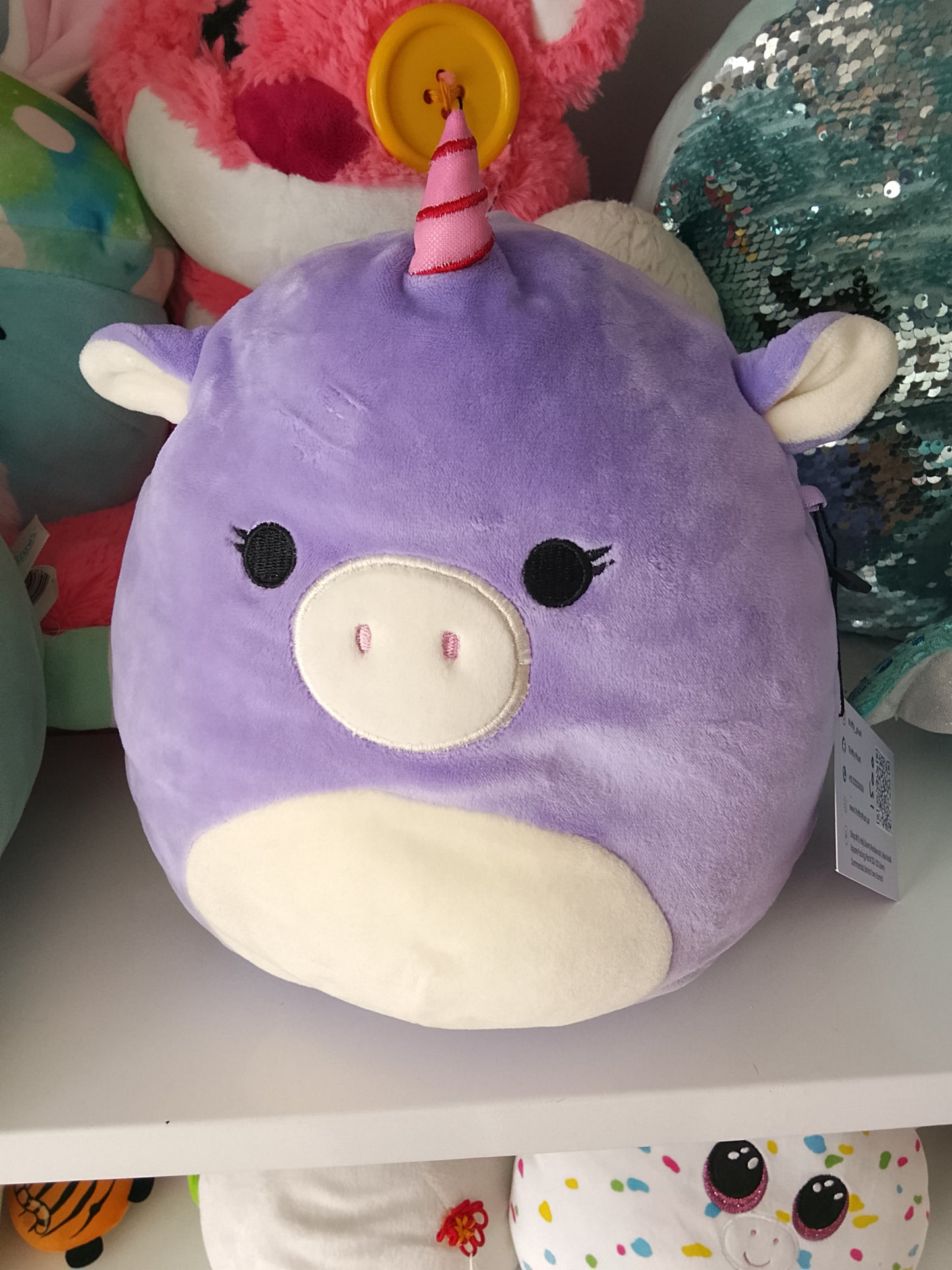 Squishmallows Astrid The Unicorn with Sleepy Eyes plush toy.