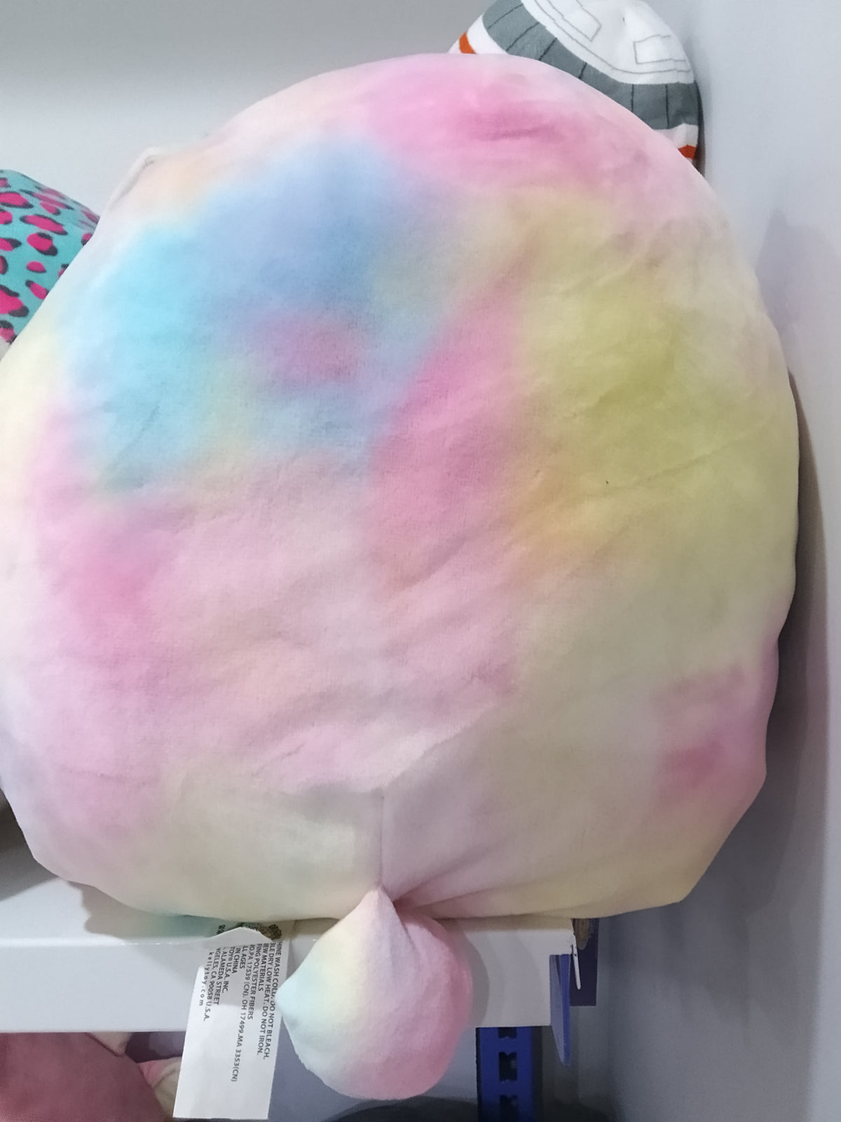 Squishmallows Candy the Rainbow Bunny plush toy.