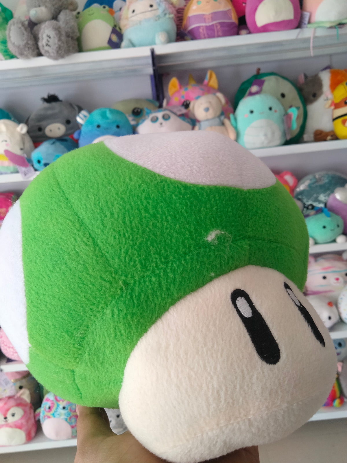 Super Mario All Star Collection 1-Up Mushroom plush doll.