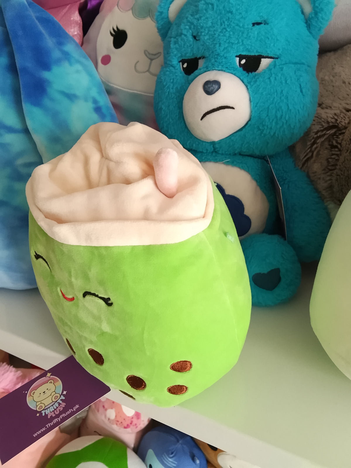 Kellytoy Squishmallows Flip-A-Mallow plush Kachina the Kiwi and Sevda the Boba Tea.