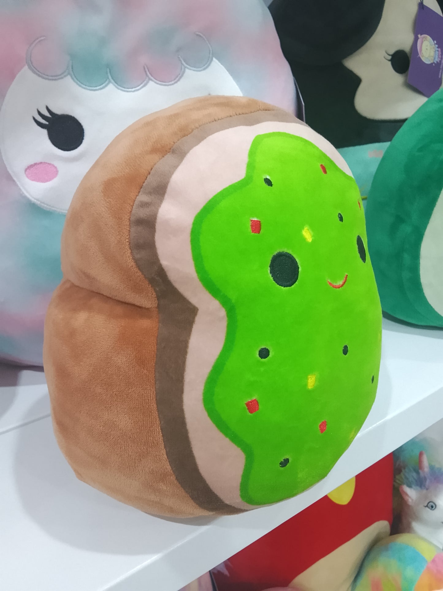 Squishmallows plush toy designed to look like Sinclair the Avocado Toast