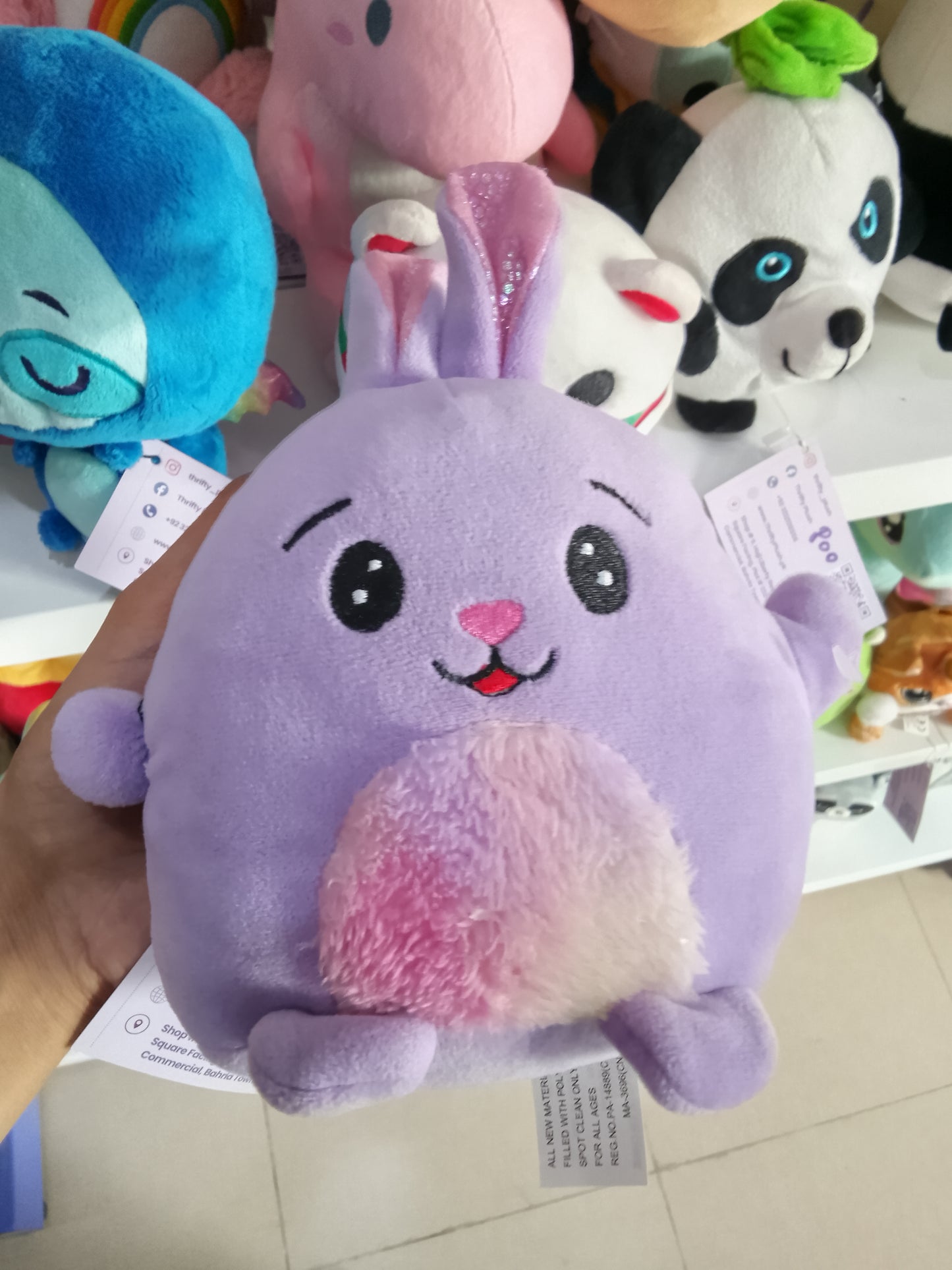 Fuzzy Friends" or "Hug & Luv" branded squishy bunny.