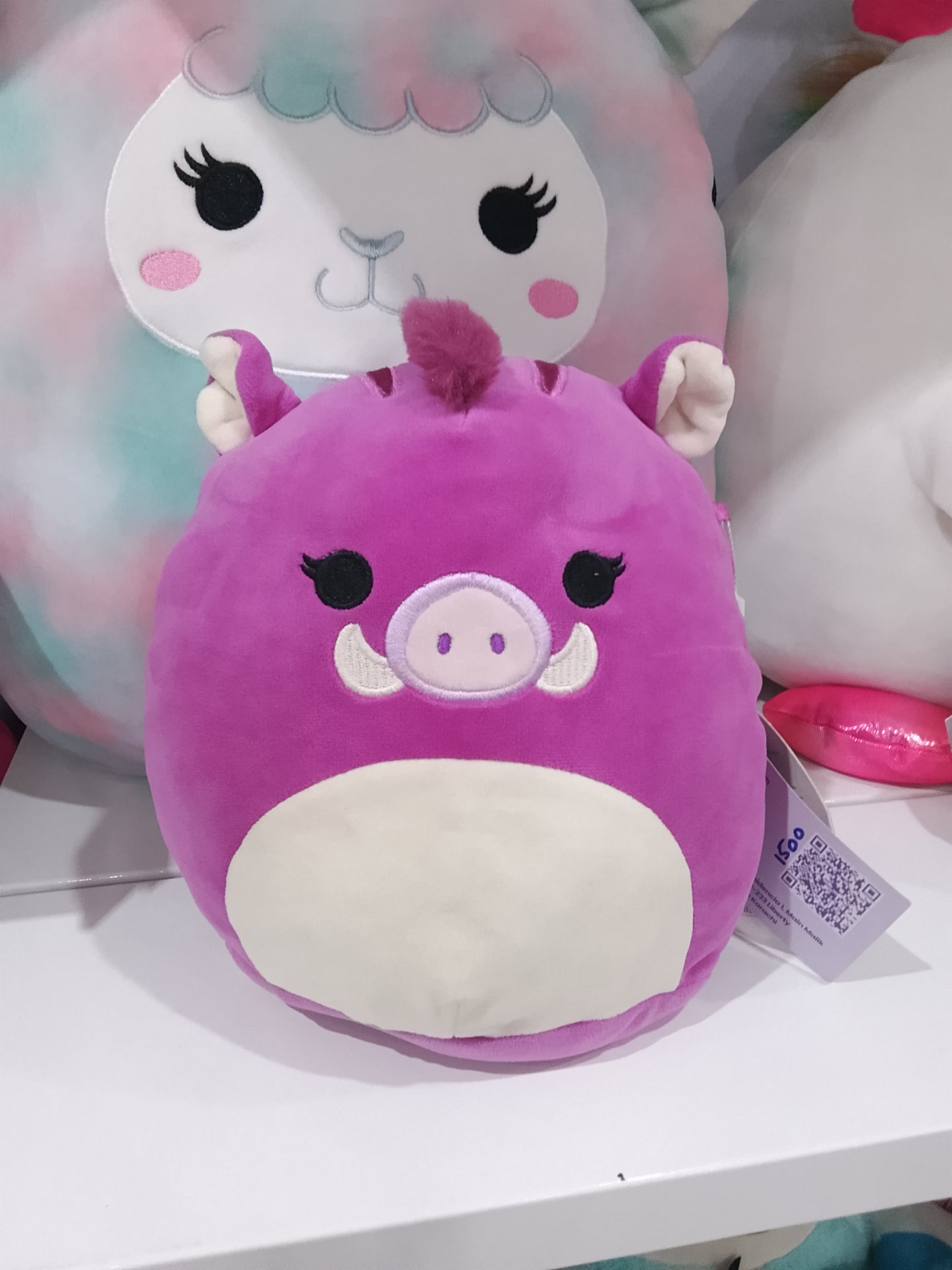 Squishmallows Jenna the Purple Boar plush toy.