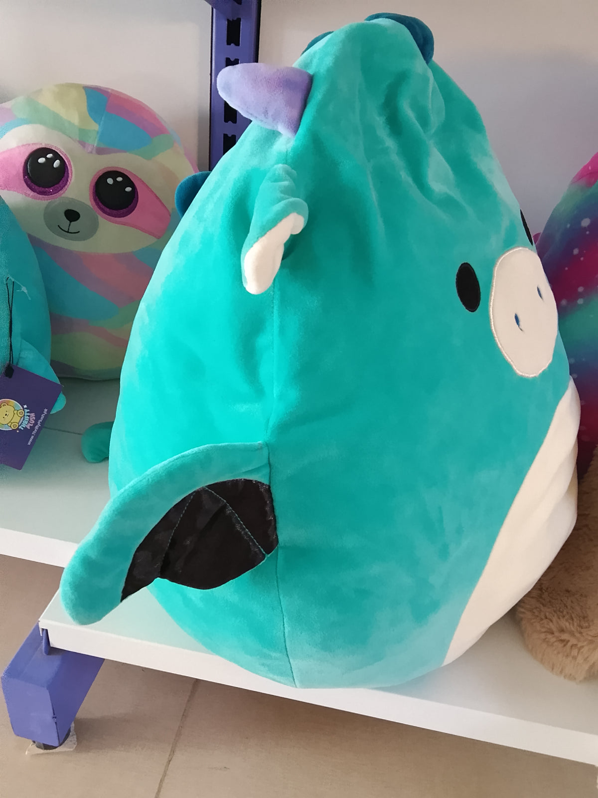 Squishmallow plush toy, likely Tatiana the Dragon or a similar character.