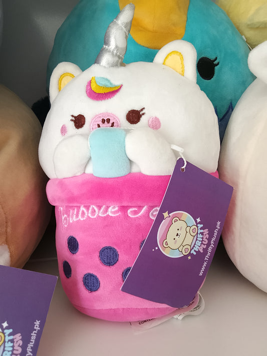 bubble tea cup featuring a unicorn character plush toy.
