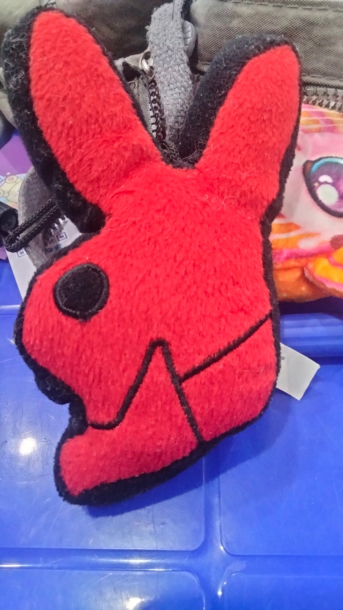 This is a red Playboy bunny plush pillow.