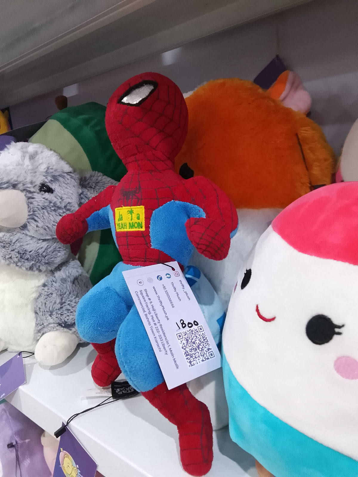 Spider-Man "JAMAICA YEAH MON" patch on its chest plush toy.