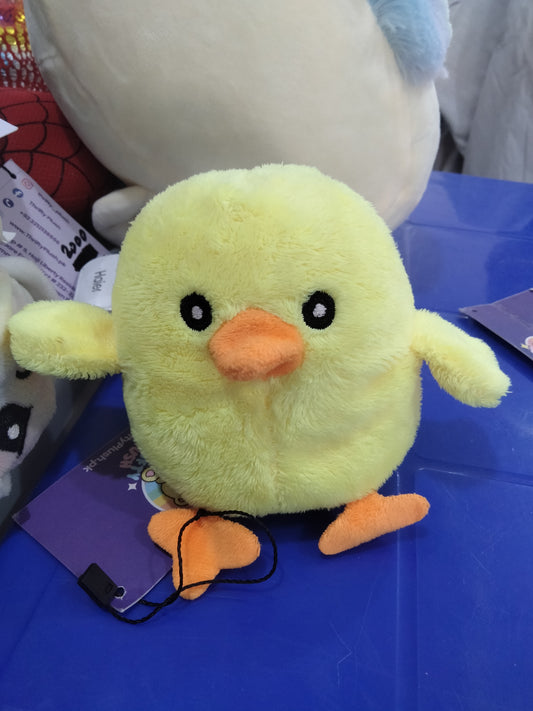yellow plush chick toy with orange feet and beak.