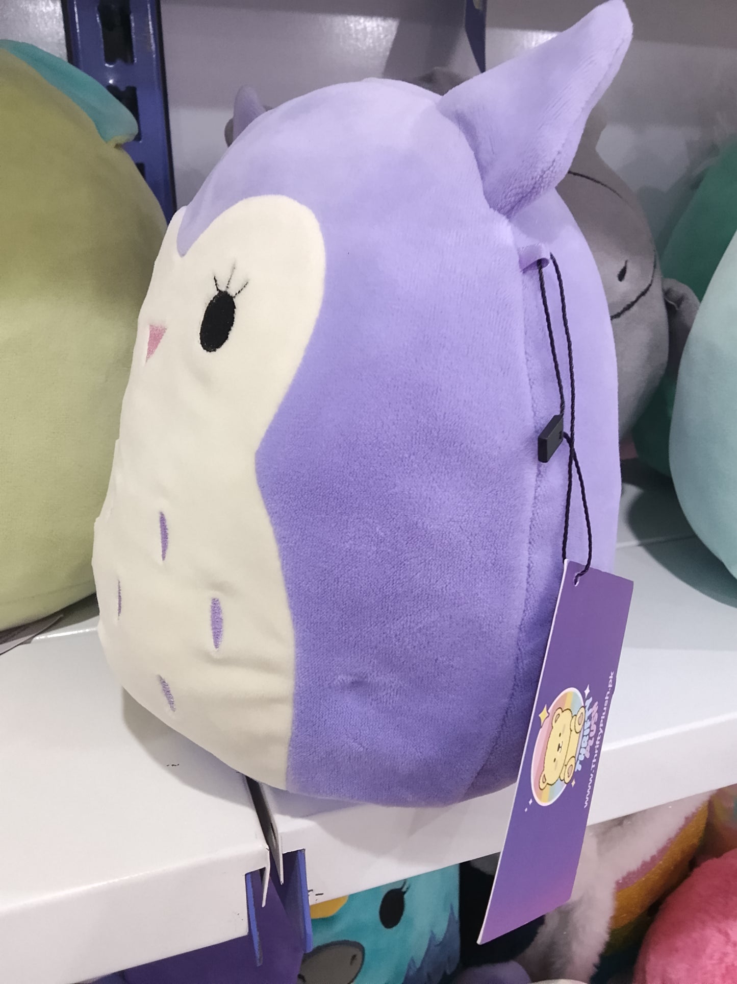 Kellytoy Squishmallows plush toy of the character Holly the Purple Owl.