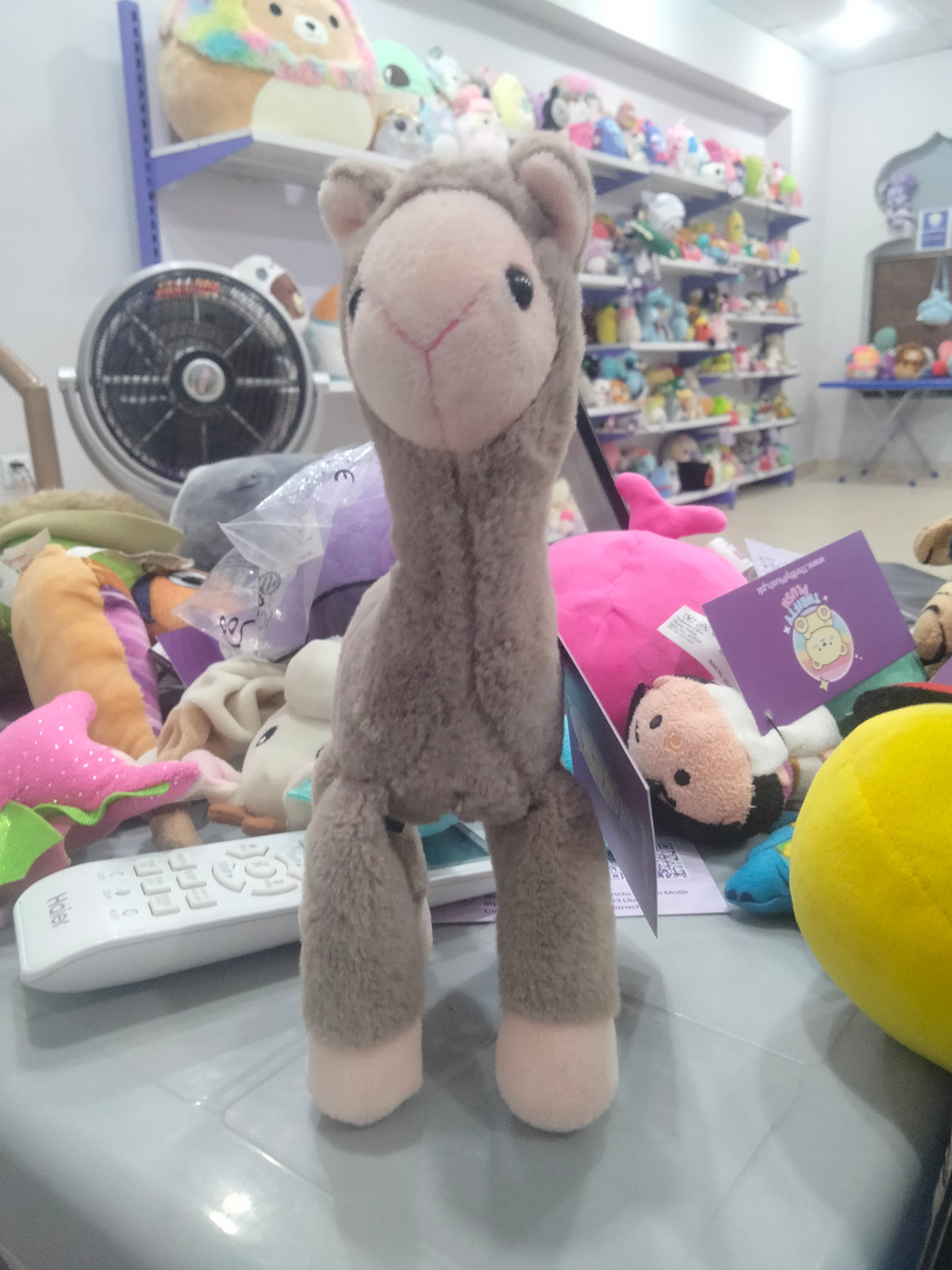 grey plush alpaca doll pendant with long legs.