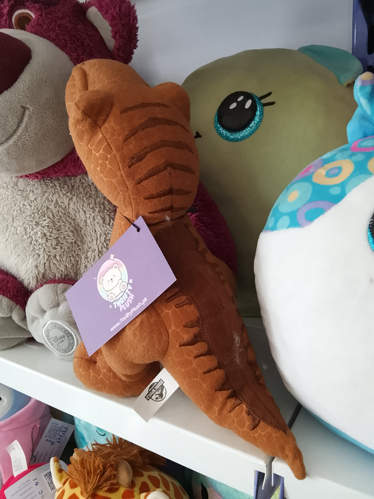 World T-Rex plush dinosaur toy.