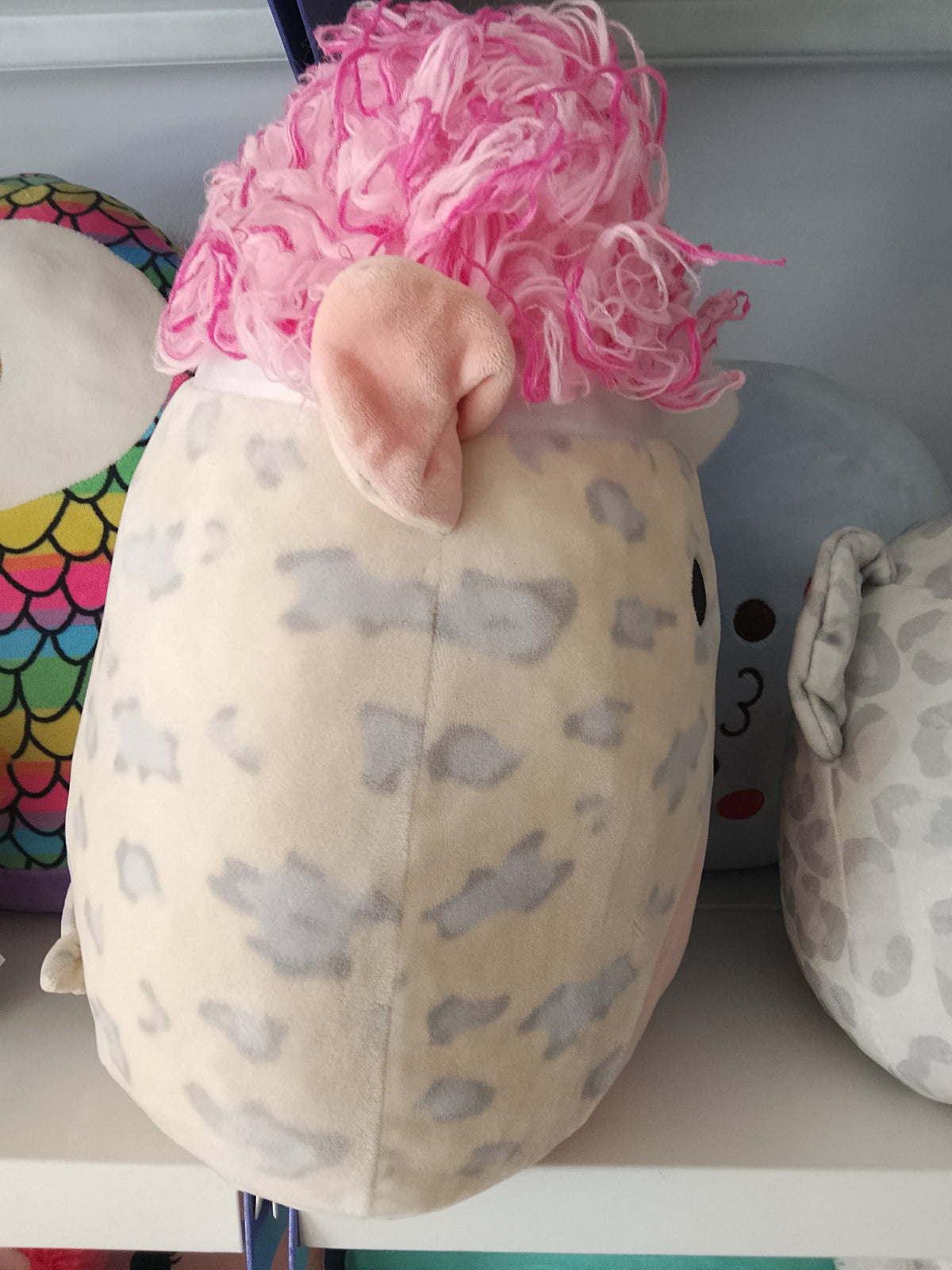 Squishmallows Squish-doos Rosie the Pig plush toy featuring a pink furry hairstyle.