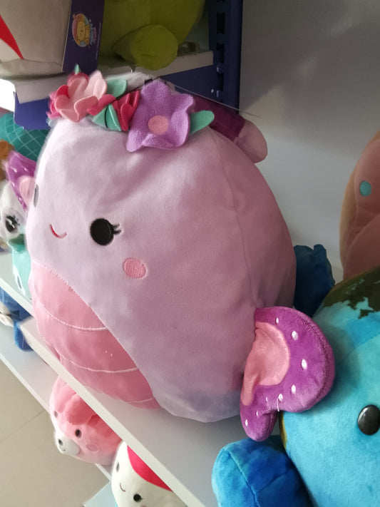 Squishmallows Brenda the Butterfly purple color, pink belly, and decorative flower crown plush toy.