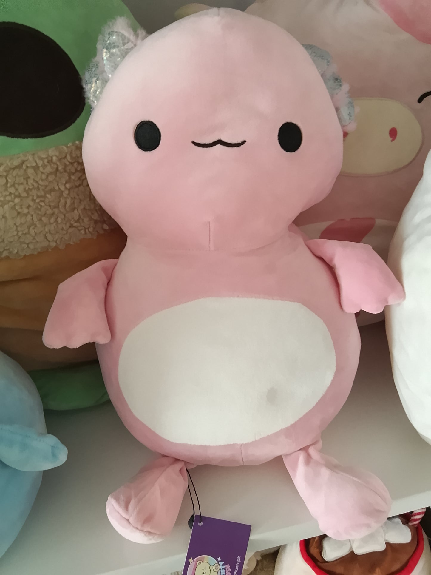 Squishmallows Archie the Axolotl plush toy.