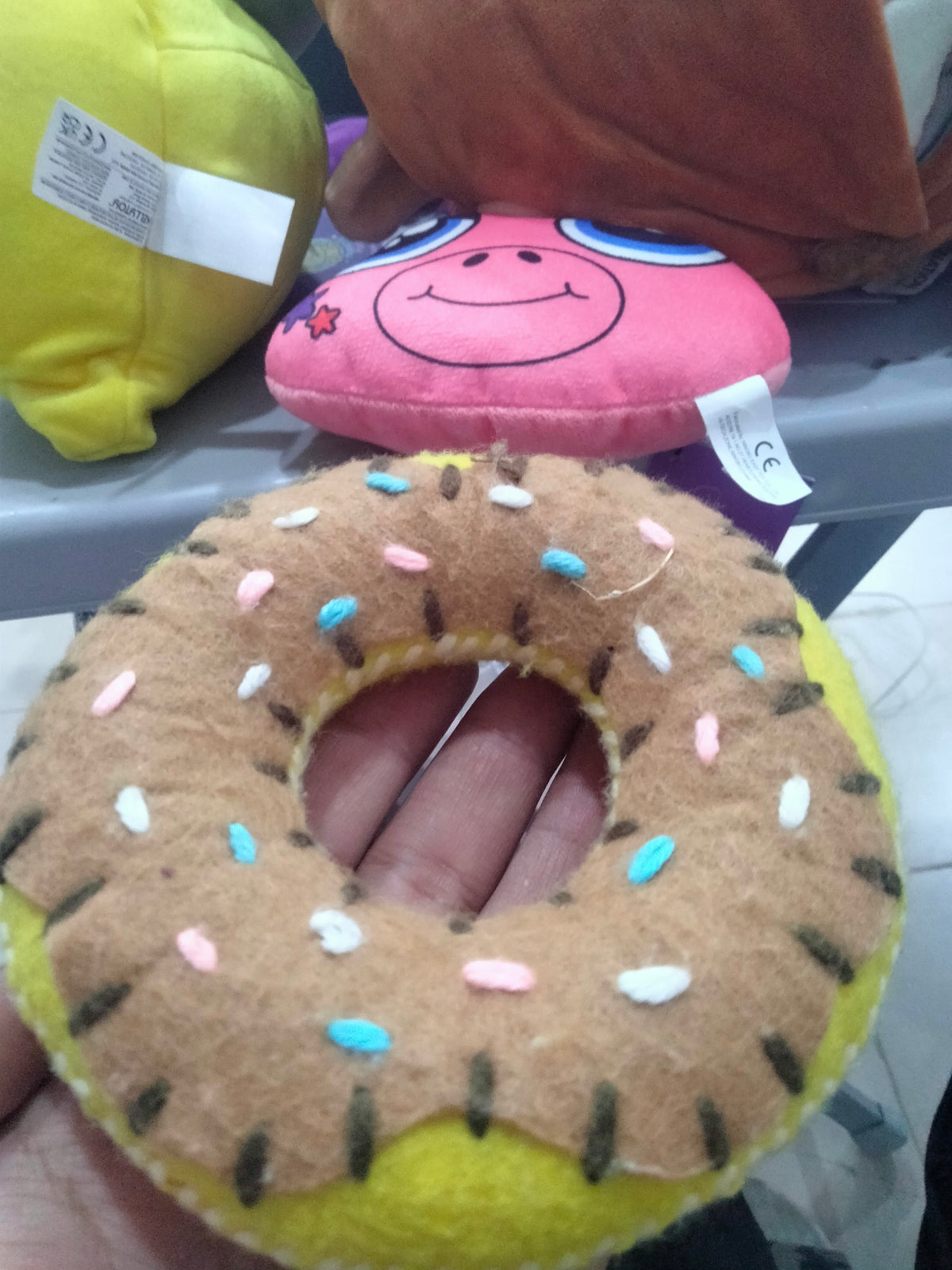 plush donut toy, often sold as a pet chew toy.