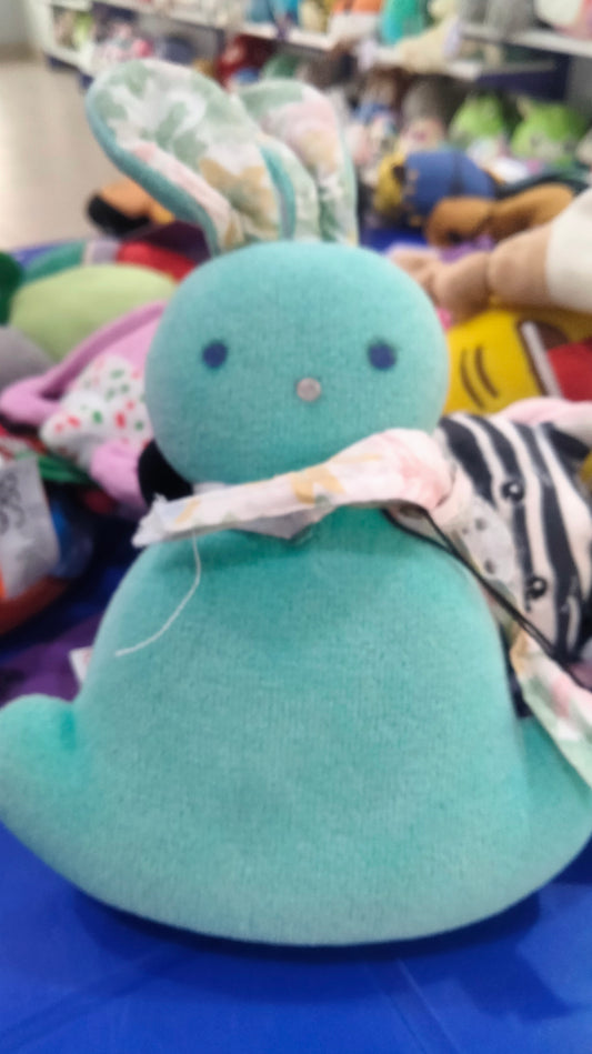 This plush toy is a turquoise IKEA GREJSIMOJS soft toy.