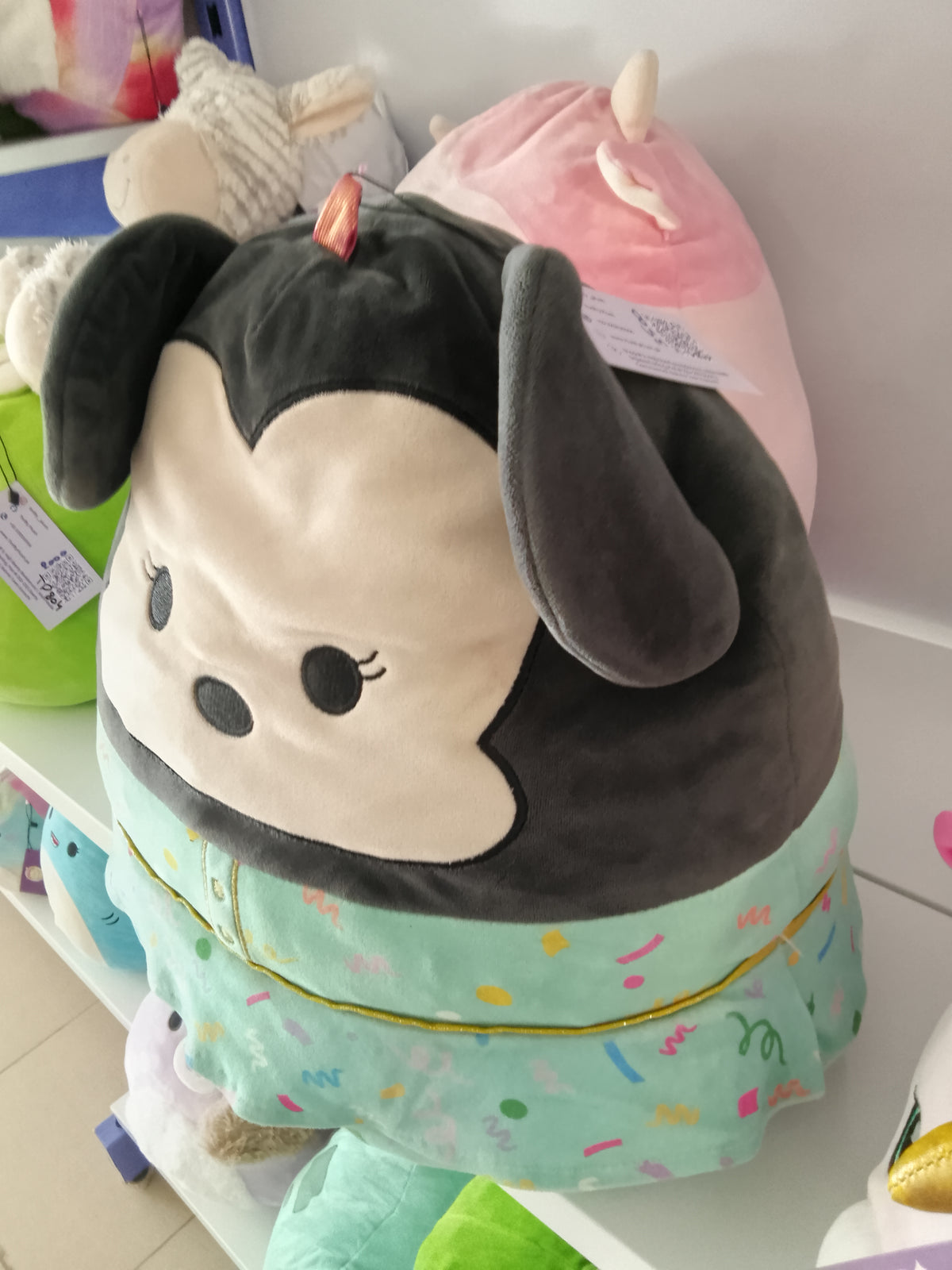 Squishmallows Disney Minnie Mouse plush toy.