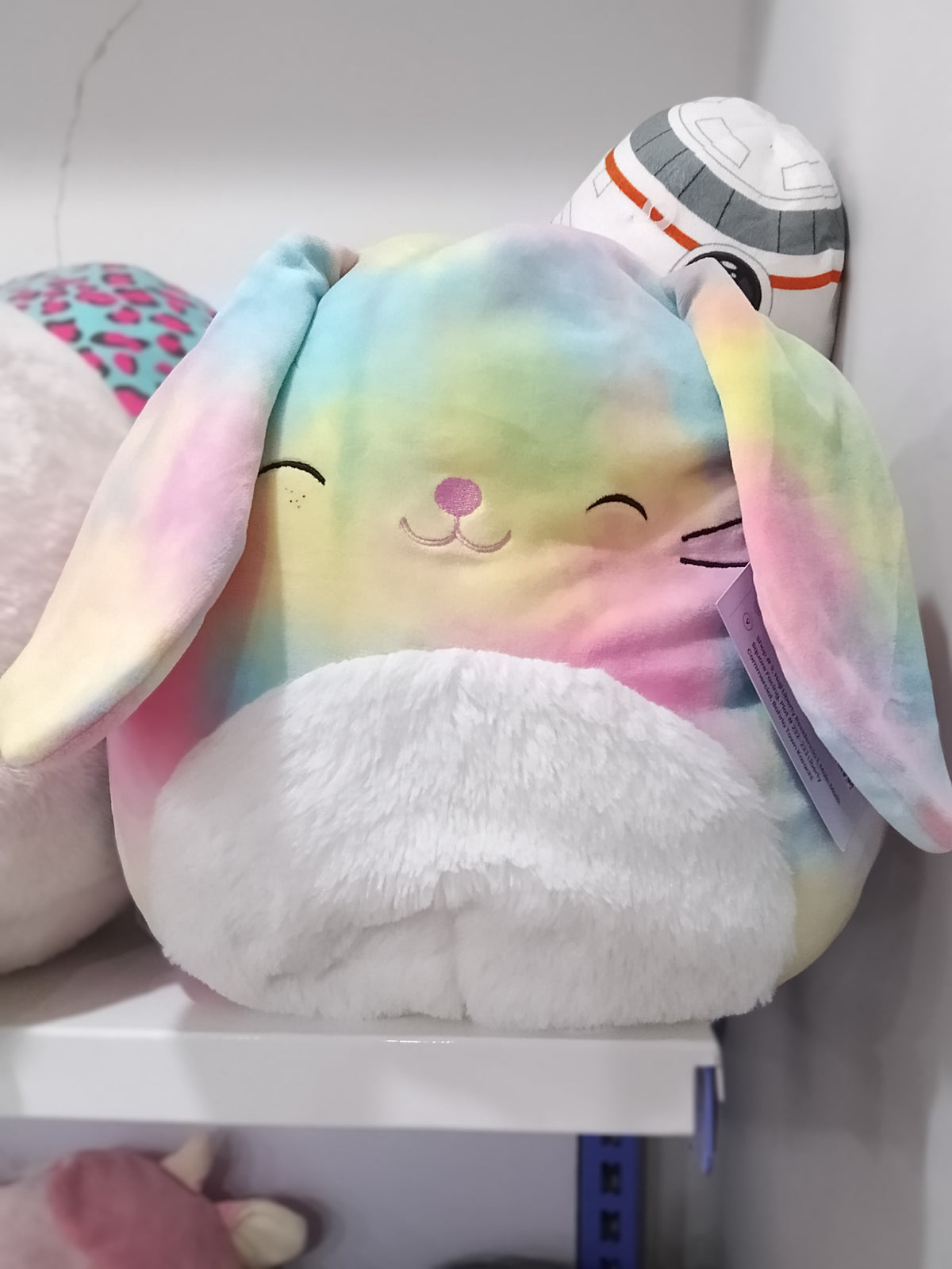 Squishmallows Candy the Rainbow Bunny plush toy.
