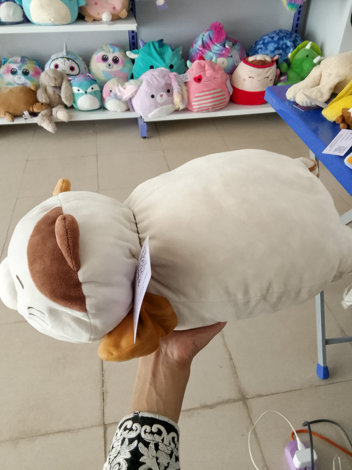 Miniso Standing Kitten plush pillow toy featuring a soft white and brown design.