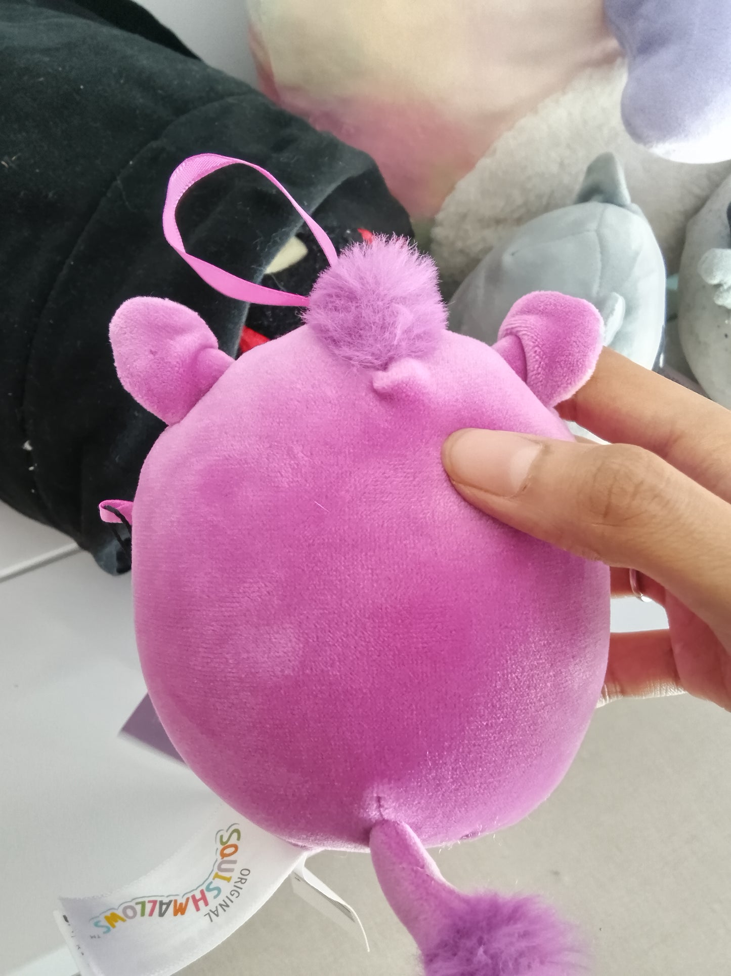 Jenna the Purple Boar from the Squishmallows brand.