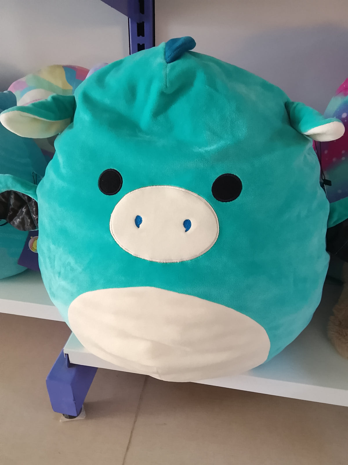 Squishmallow plush toy, likely Tatiana the Dragon or a similar character.