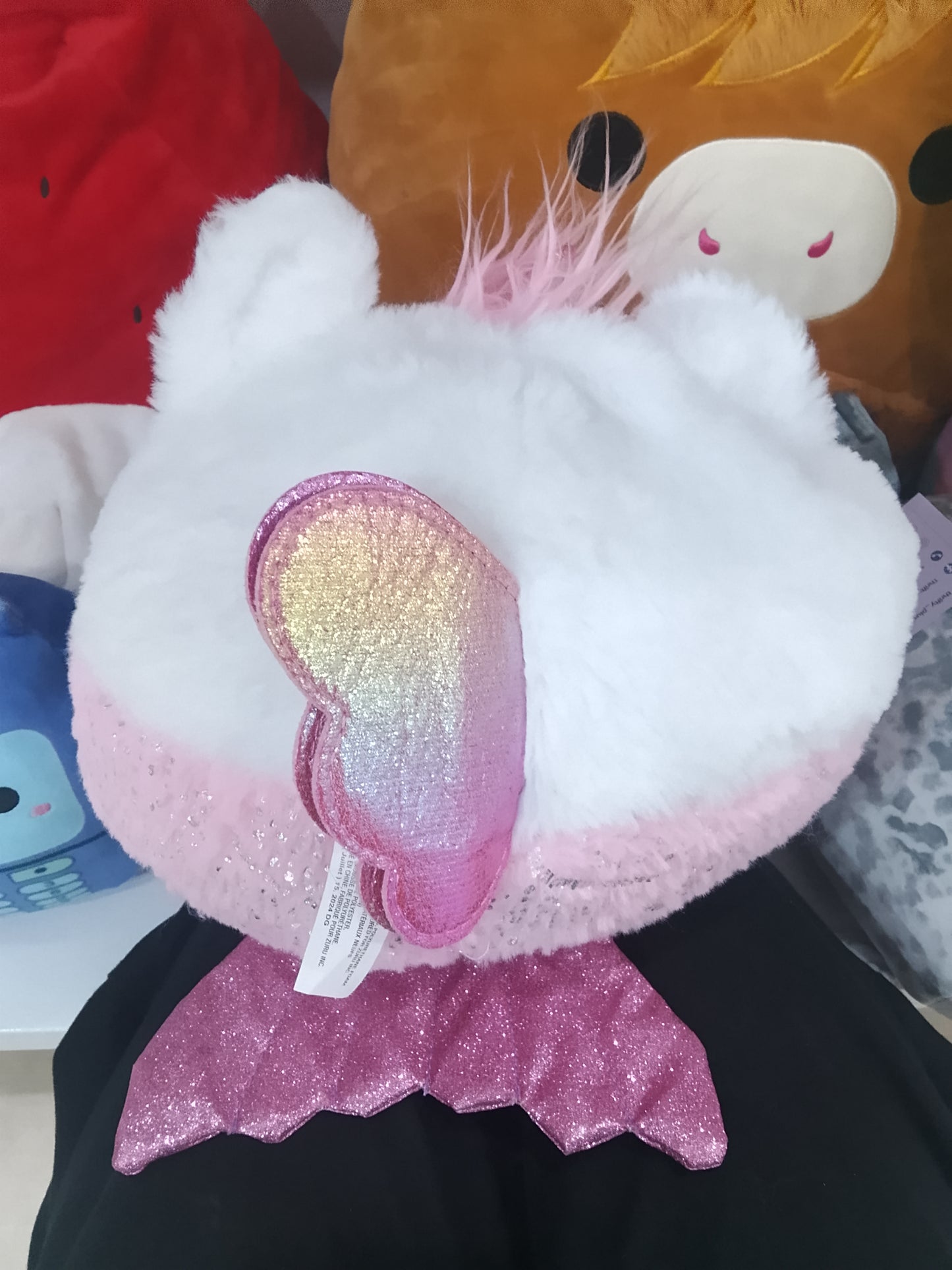 ZURU Rainbocorns Mermaidcorn kitten plush white furry face, pink hair, and a sparkly pink glitter heart.