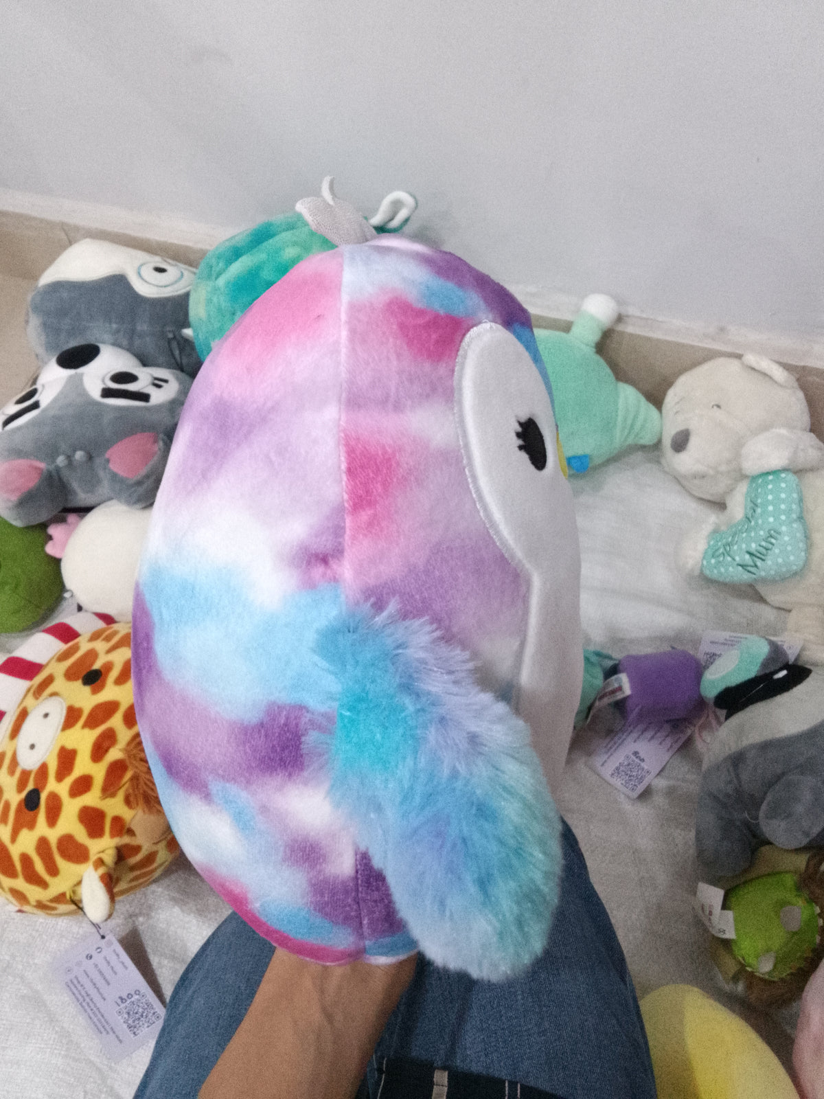 Squishmallows Tomara the Penguin tie-dye plush toy.
