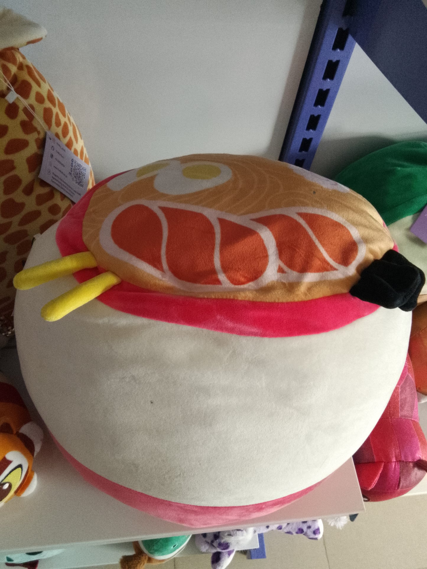 Squishmallows plush toy featuring the character Raisy the Ramen.