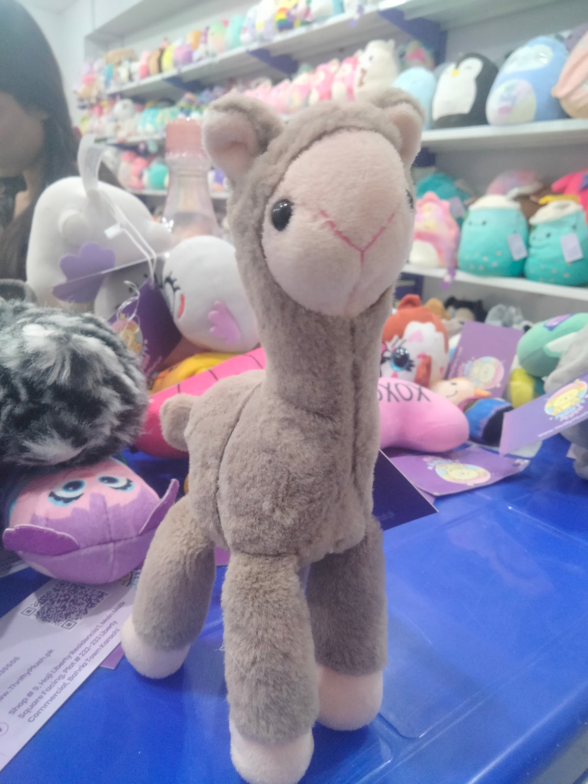 grey plush alpaca doll pendant with long legs.