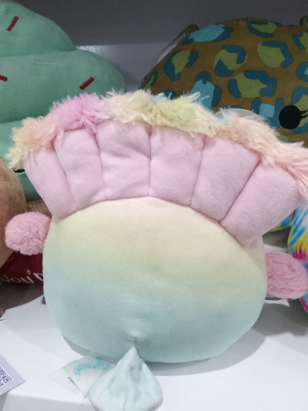 Squishmallows Briannika the Peacock plush toy, pastel ombre design and fluffy wings.