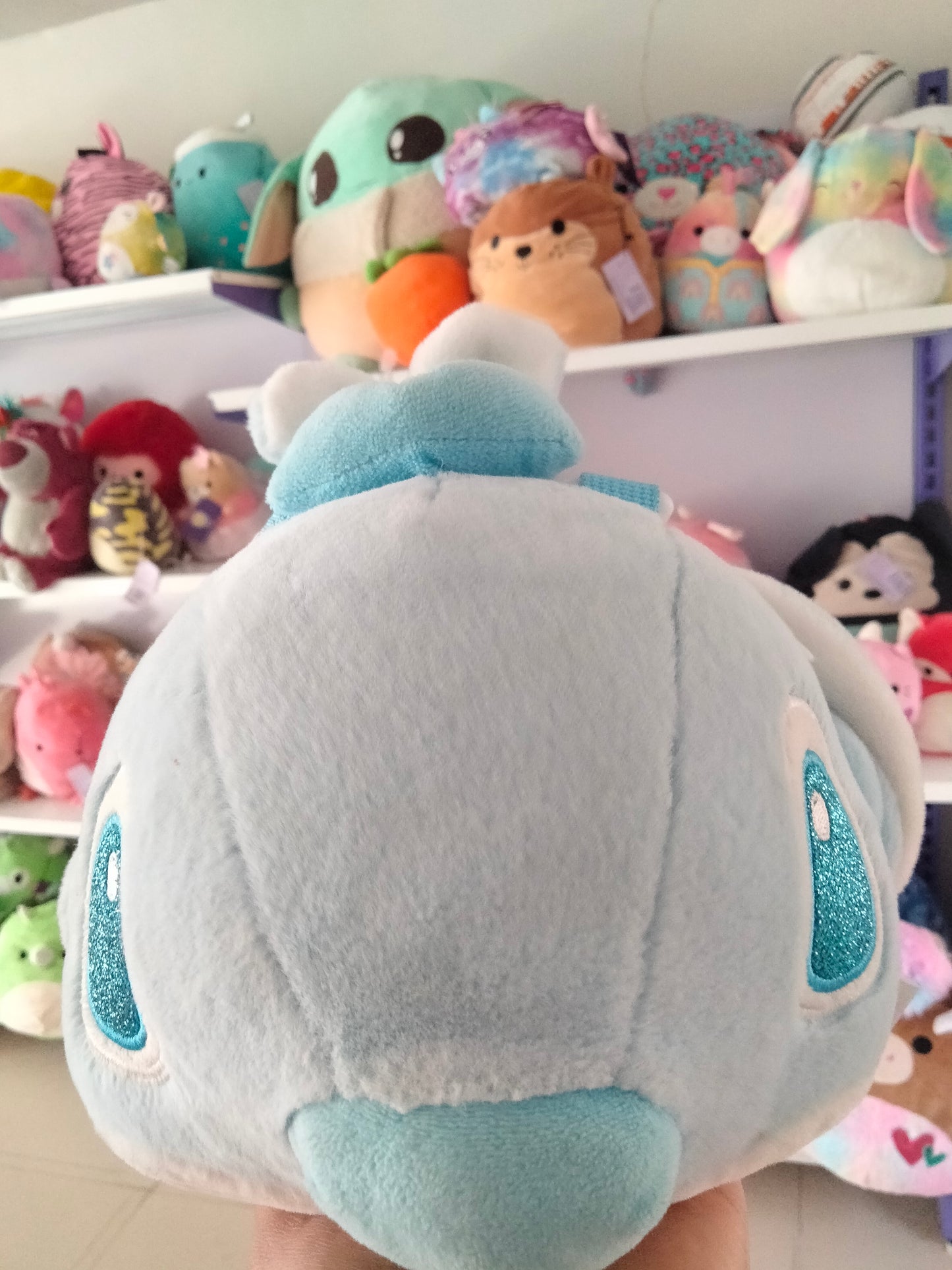 cartoon backpack features a plush toy
