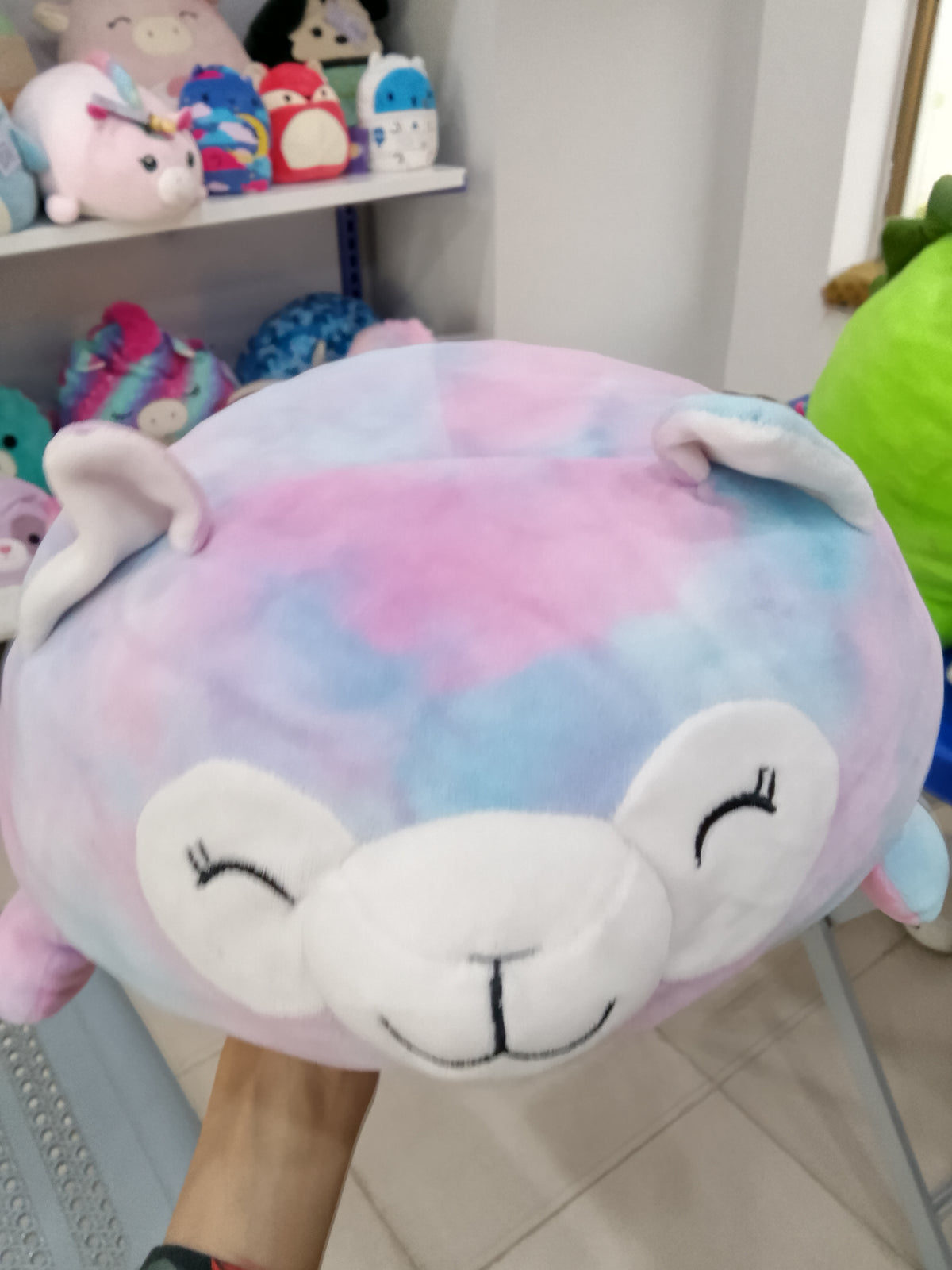 Squishmallows Lana the Rainbow Lamb Sleepamallow plush toy.