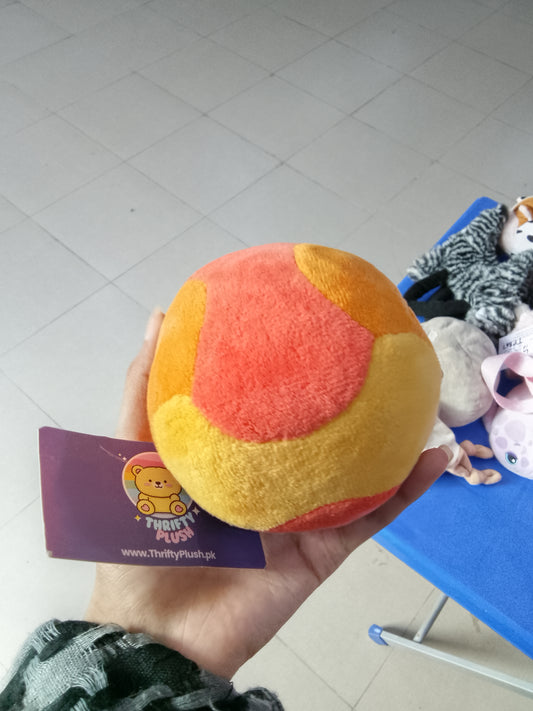 Ronaldinho branded orange plush soccer ball collectible.