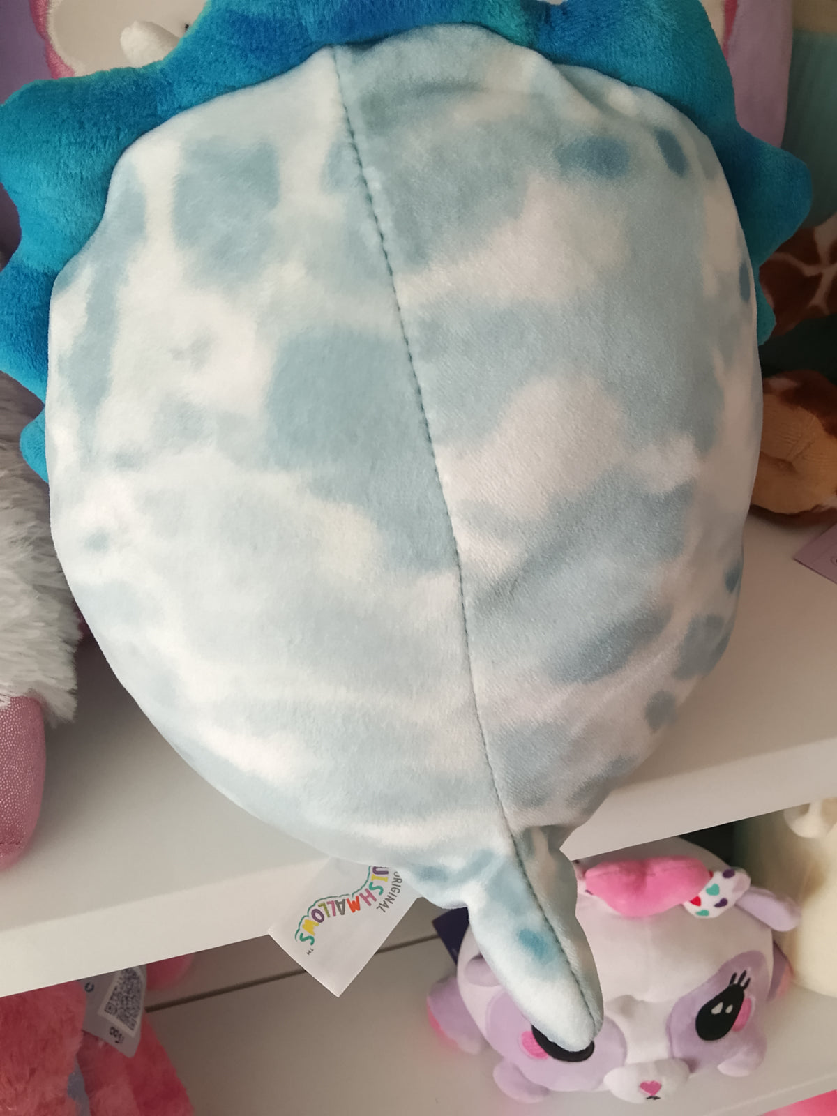 Squishmallows Jerome The Blue Triceratops plush toy.