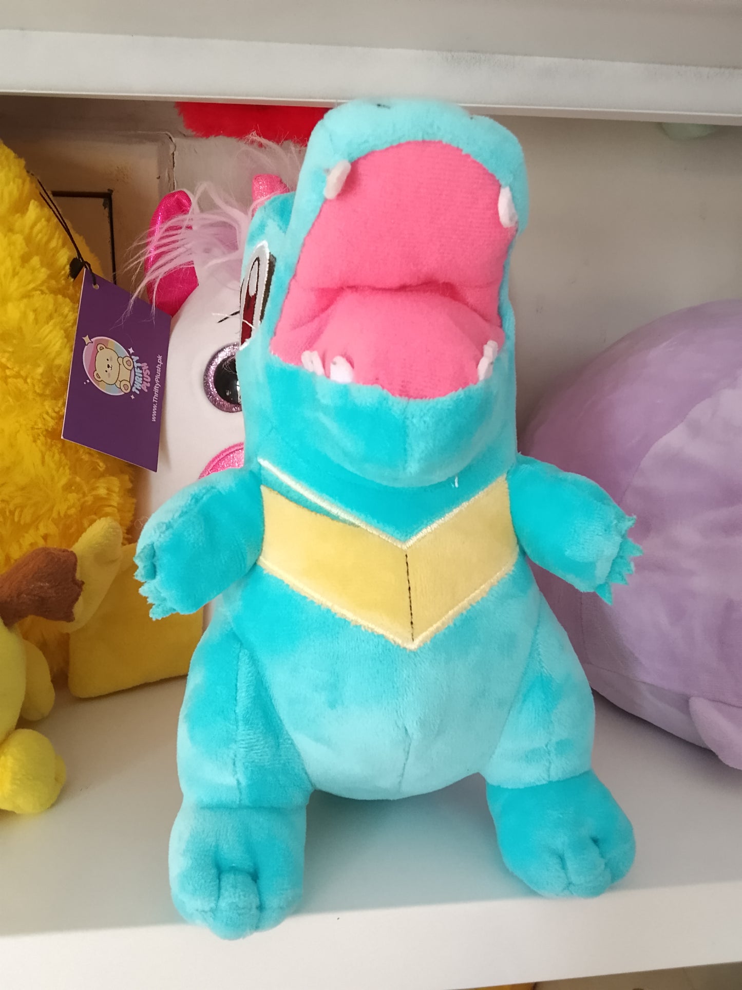Totodile plush toy, a popular character from the Pokémon franchise.