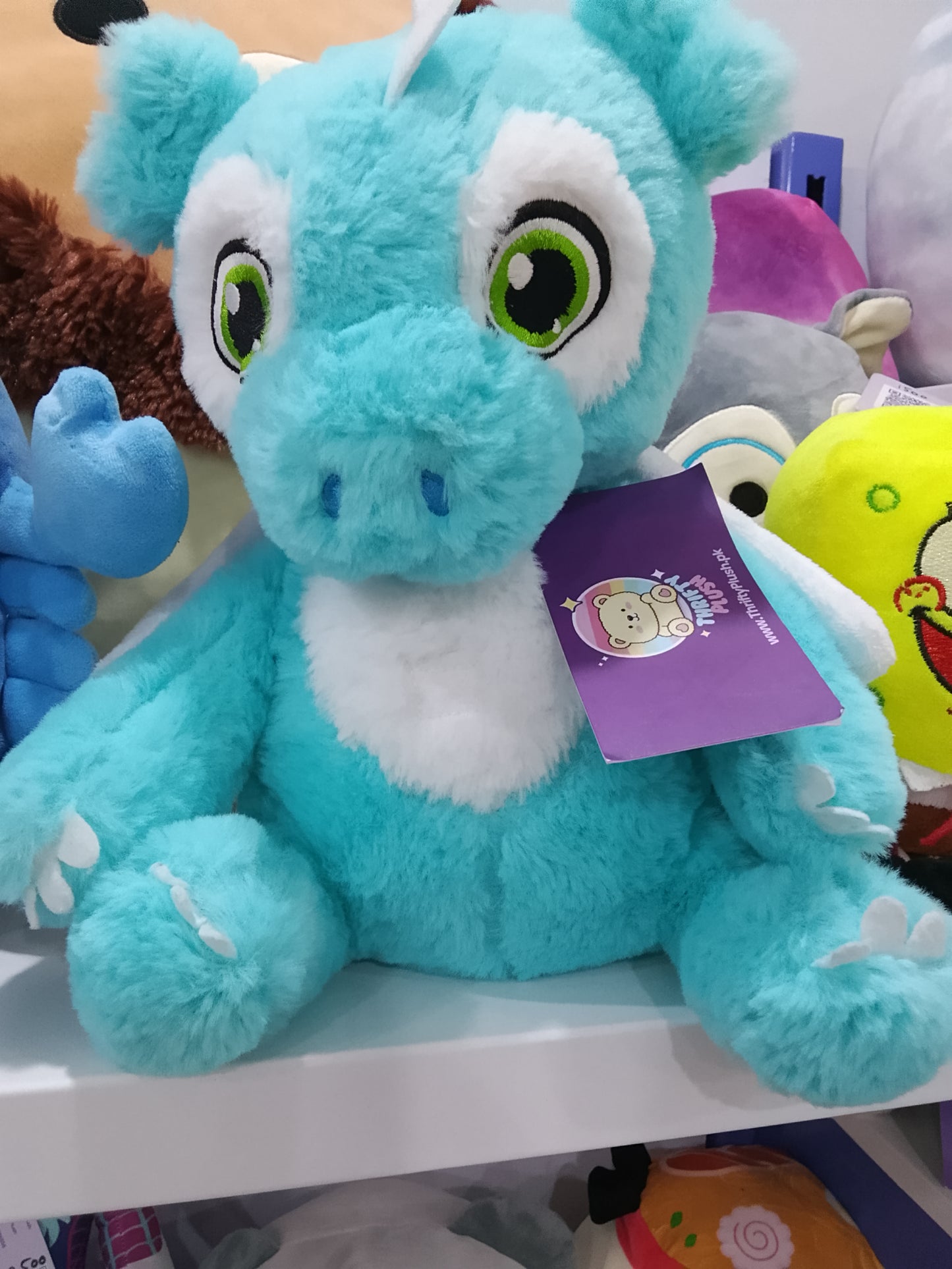 Blue dragon plush toy.