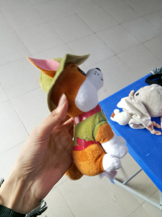 PAW Patrol Tracker plush toy featuring his signature green jungle hat and vest.