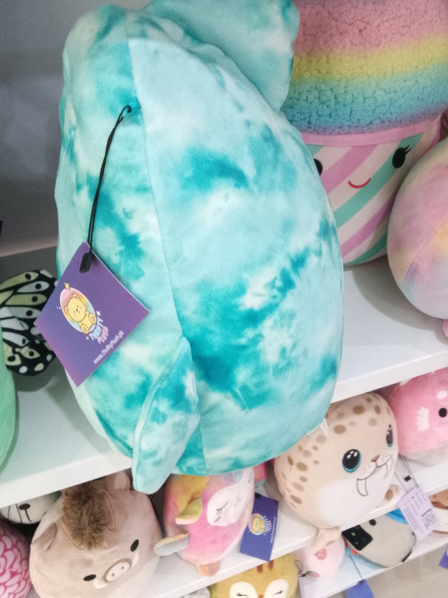 Squishmallows Danika the Blue Tie-Dye Dolphin plush toy.