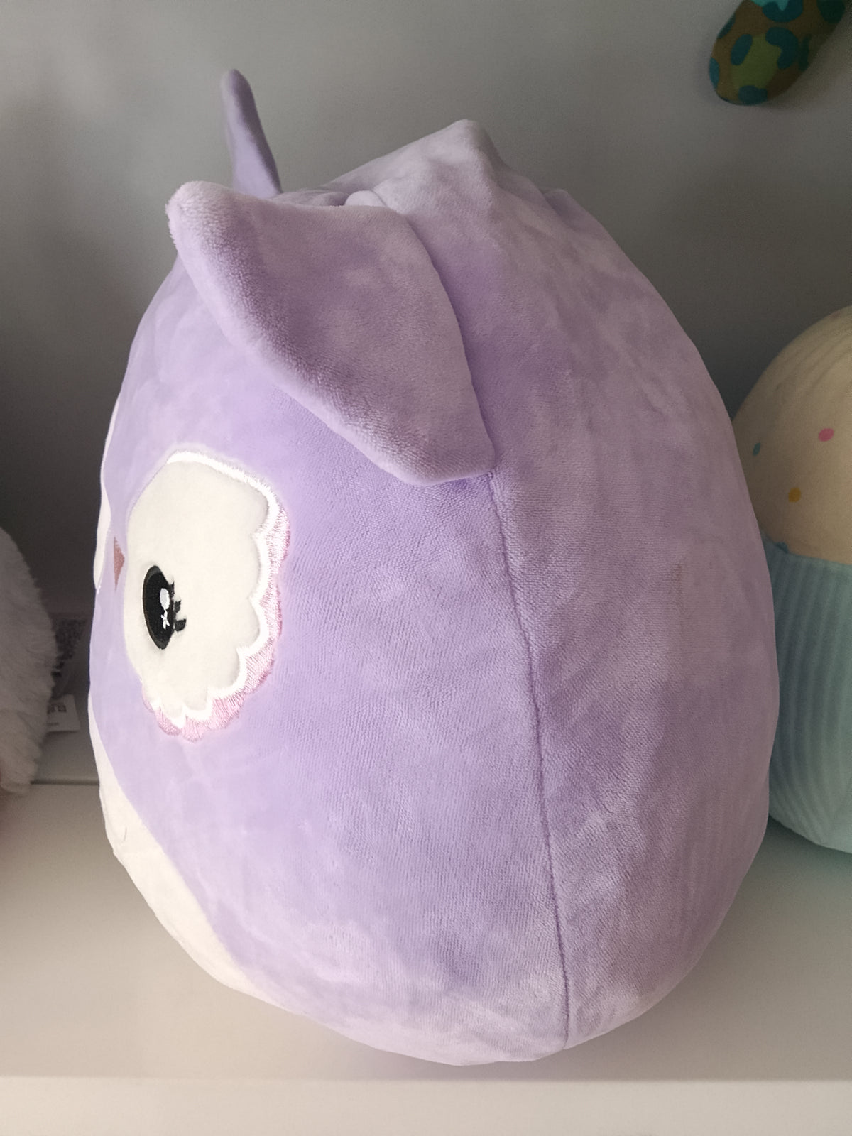 Squishmallows plush toy featuring Miranda the Purple Owl