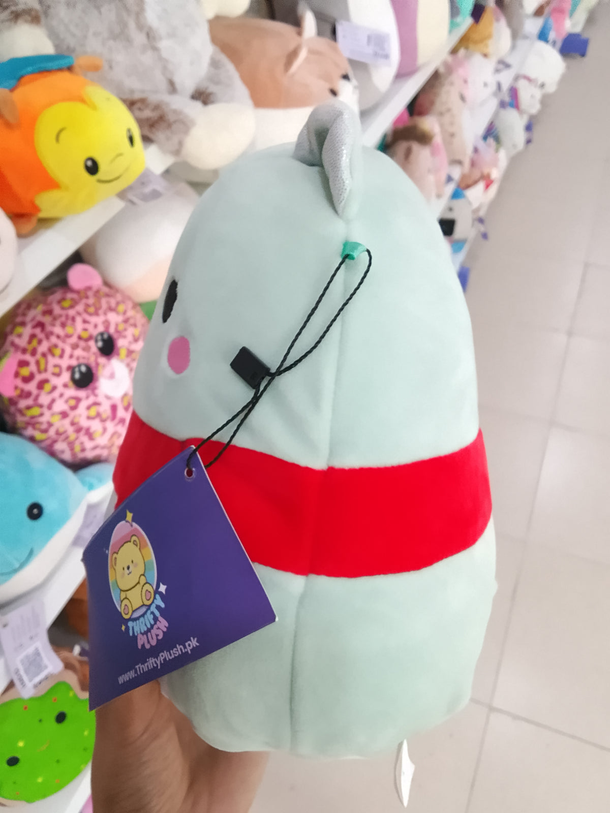 Squishmallows Bliss the Sparkle Bear plush toy .