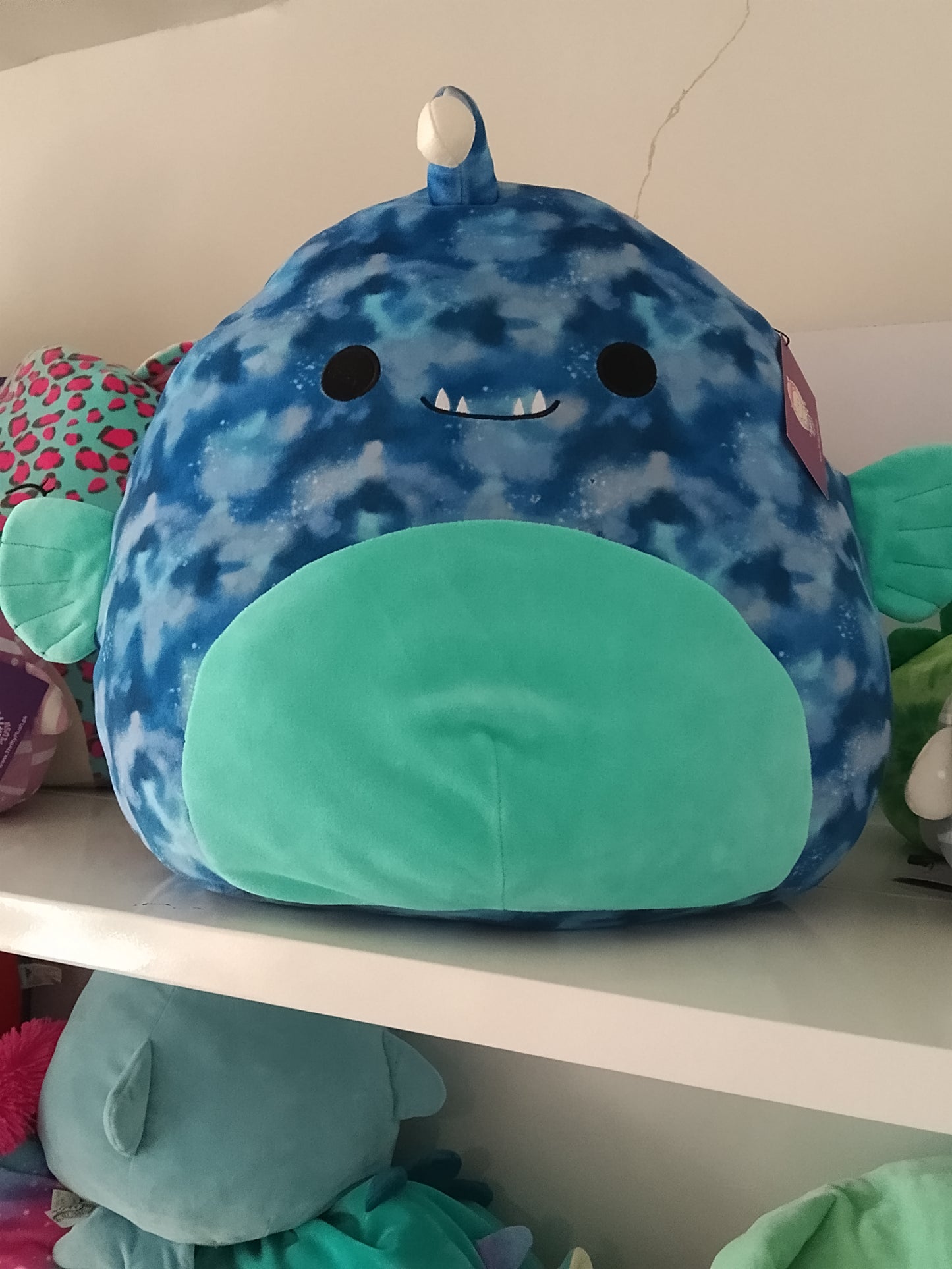 Squishmallows plush toy of Deezo the Anglerfish.