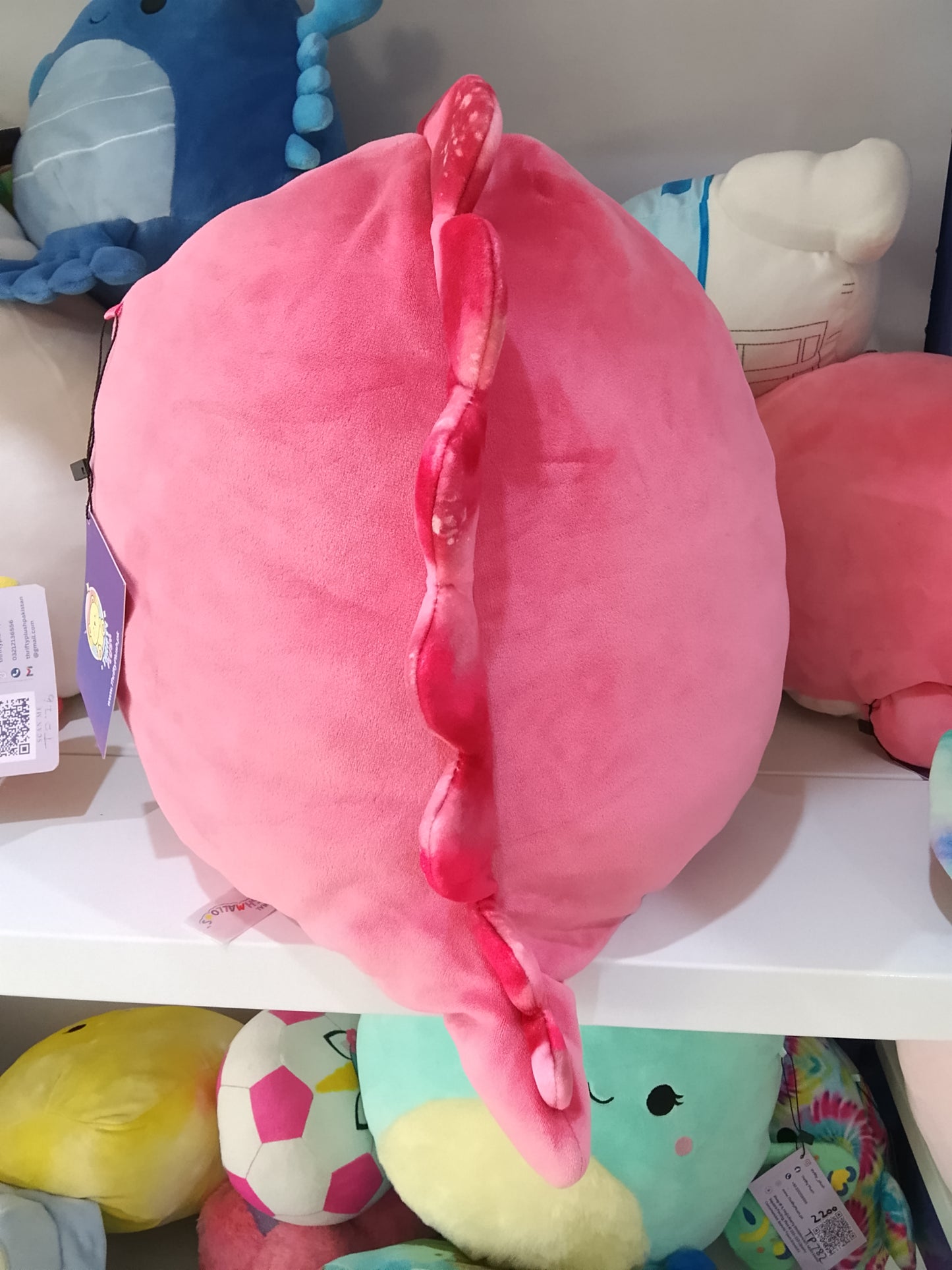 Squishmallows plush toy featuring the character Poleena the Red Dinosaur.