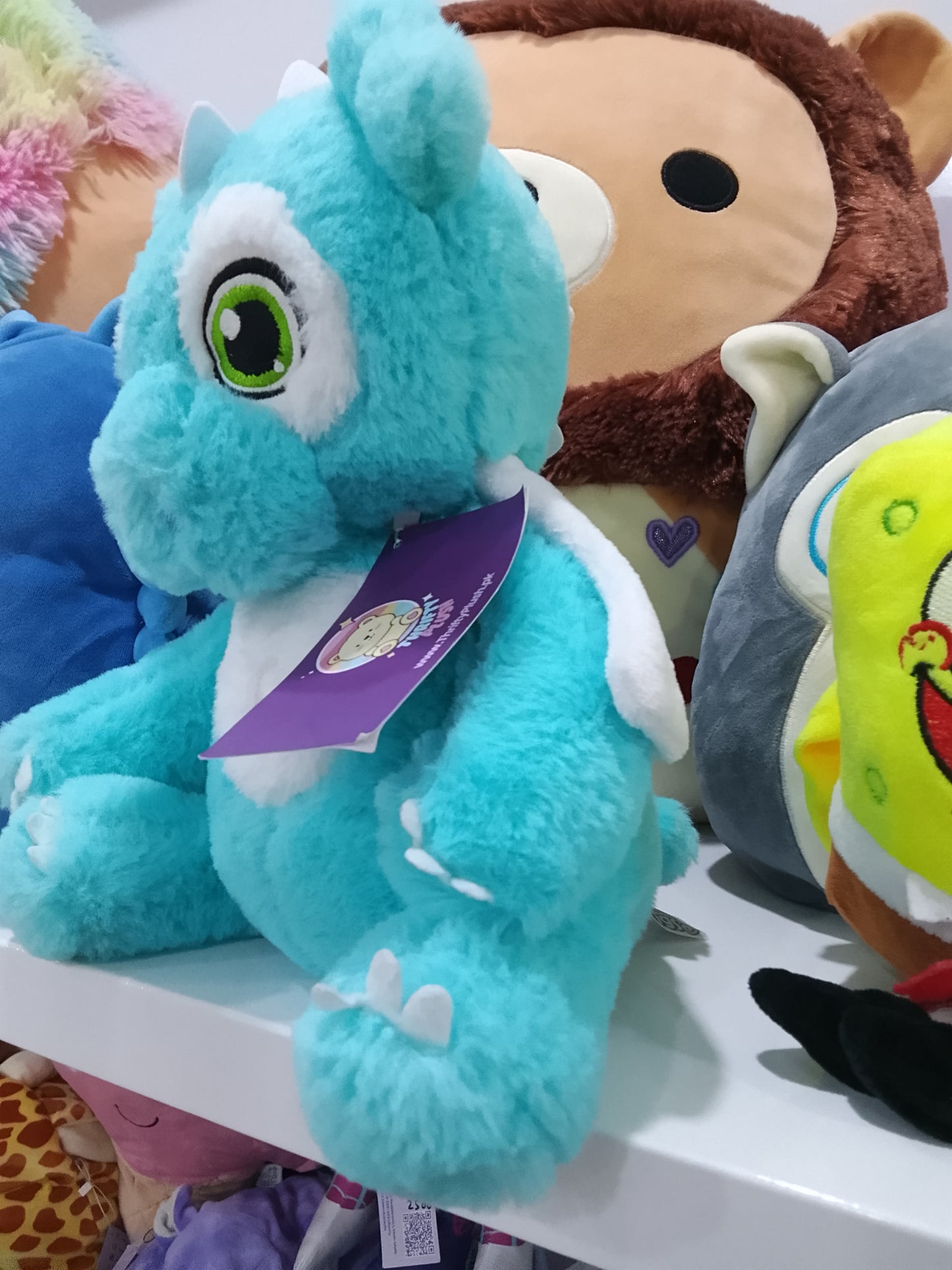 Blue dragon plush toy.