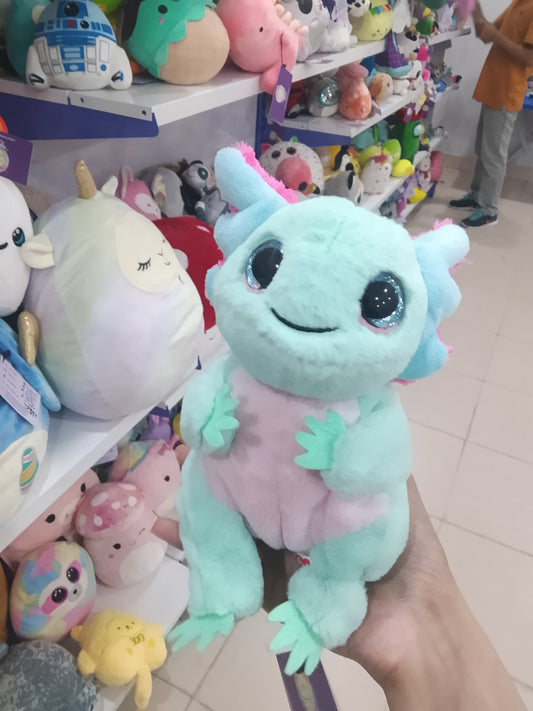 Ty Beanie Bellies Alex the Pastel Axolotl plush toy with glittery blue eyes.