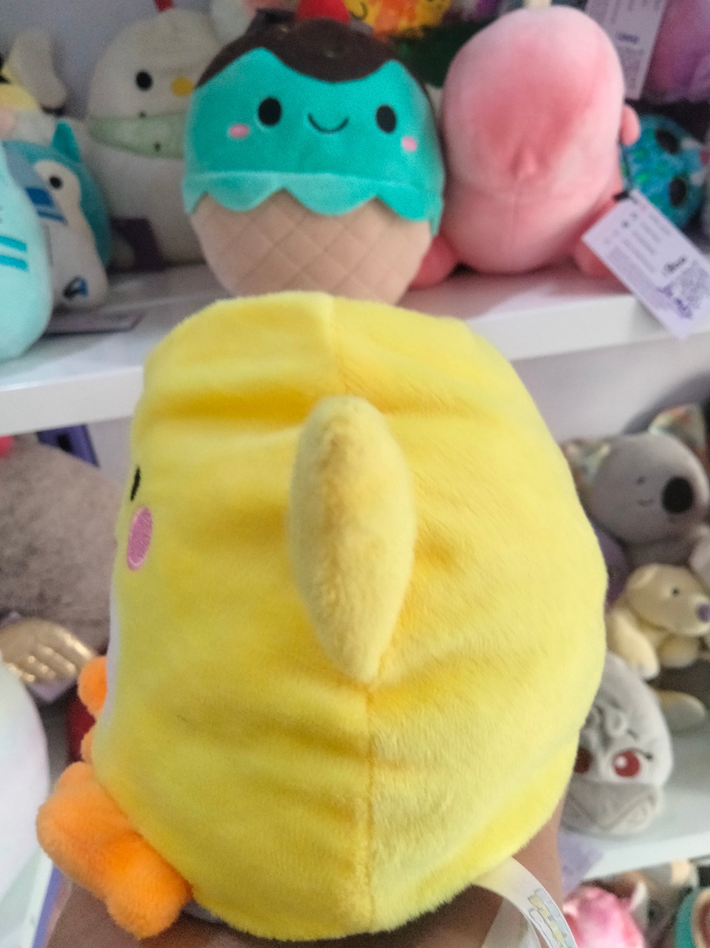yellow Piu Piu stuffed animal plush toy by Aurora World.