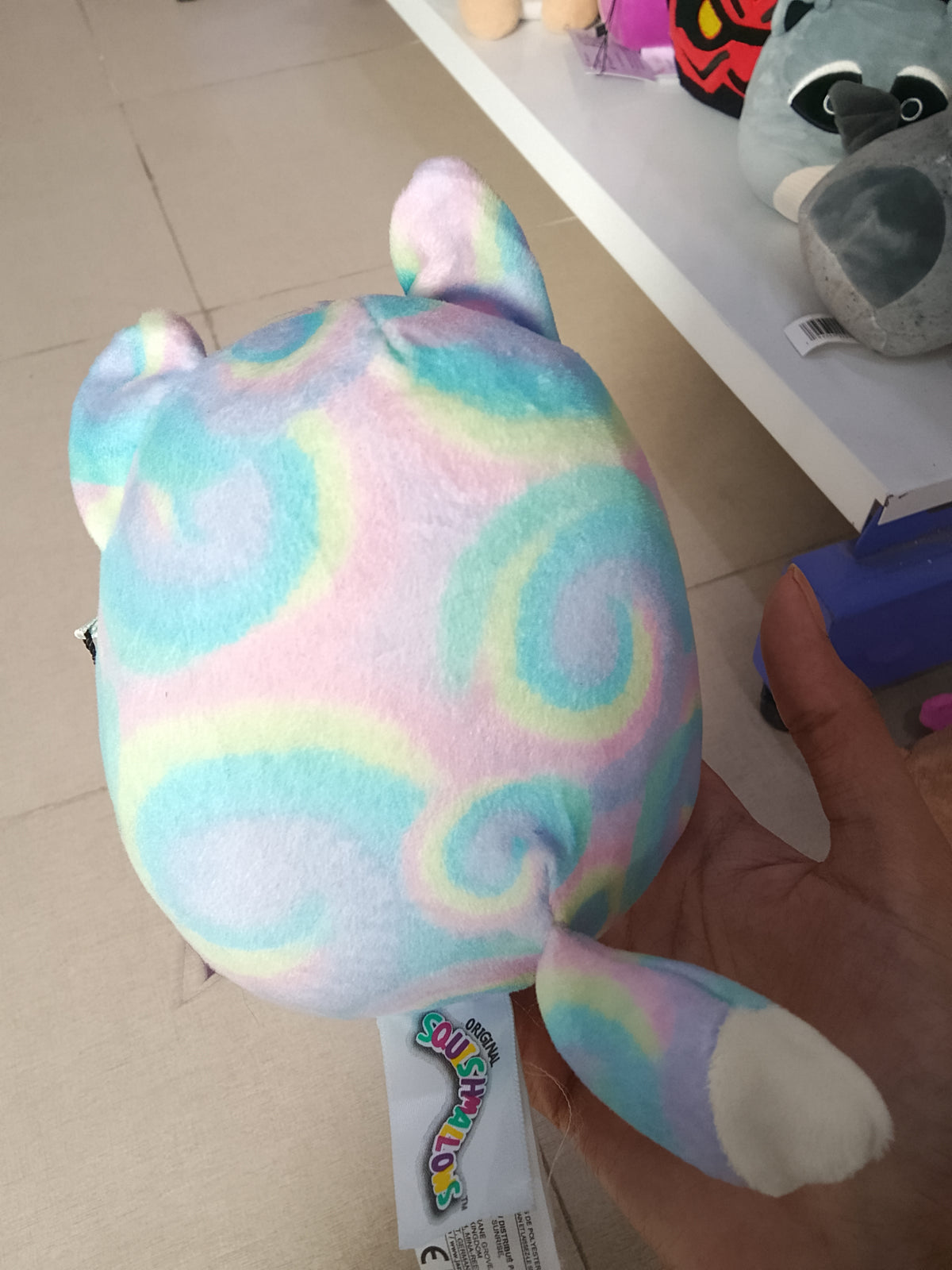 Squishmallows Felexine the Rainbow Fox plush toy.